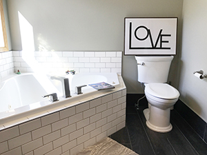 New master bath Jacuzzi with white subway tile in remodeled bathroom in Rochester, MN